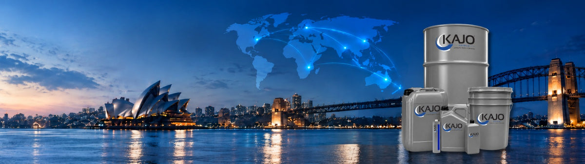 Three KAJO branded metal paint drums displayed in front of a nighttime Sydney harbor skyline with the Opera House, Sydney Harbour Bridge, and a glowing blue world map graphic.